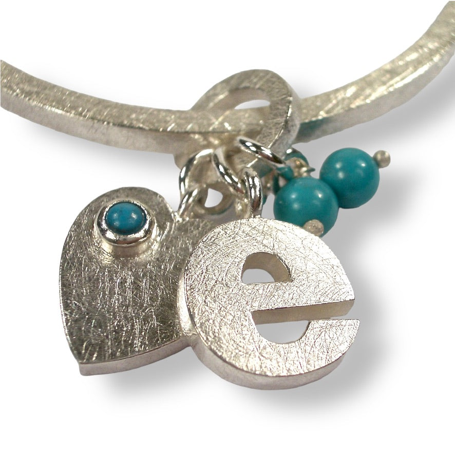 Katherine&#39;s Custom Bespoke E, Heart And Birthstone Baby Charm Bangle For Christening Gift  | In Silver | Set With Turquoise
